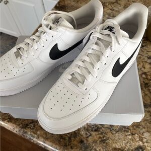 Nike White Low-Top Sneakers with Black Swoosh